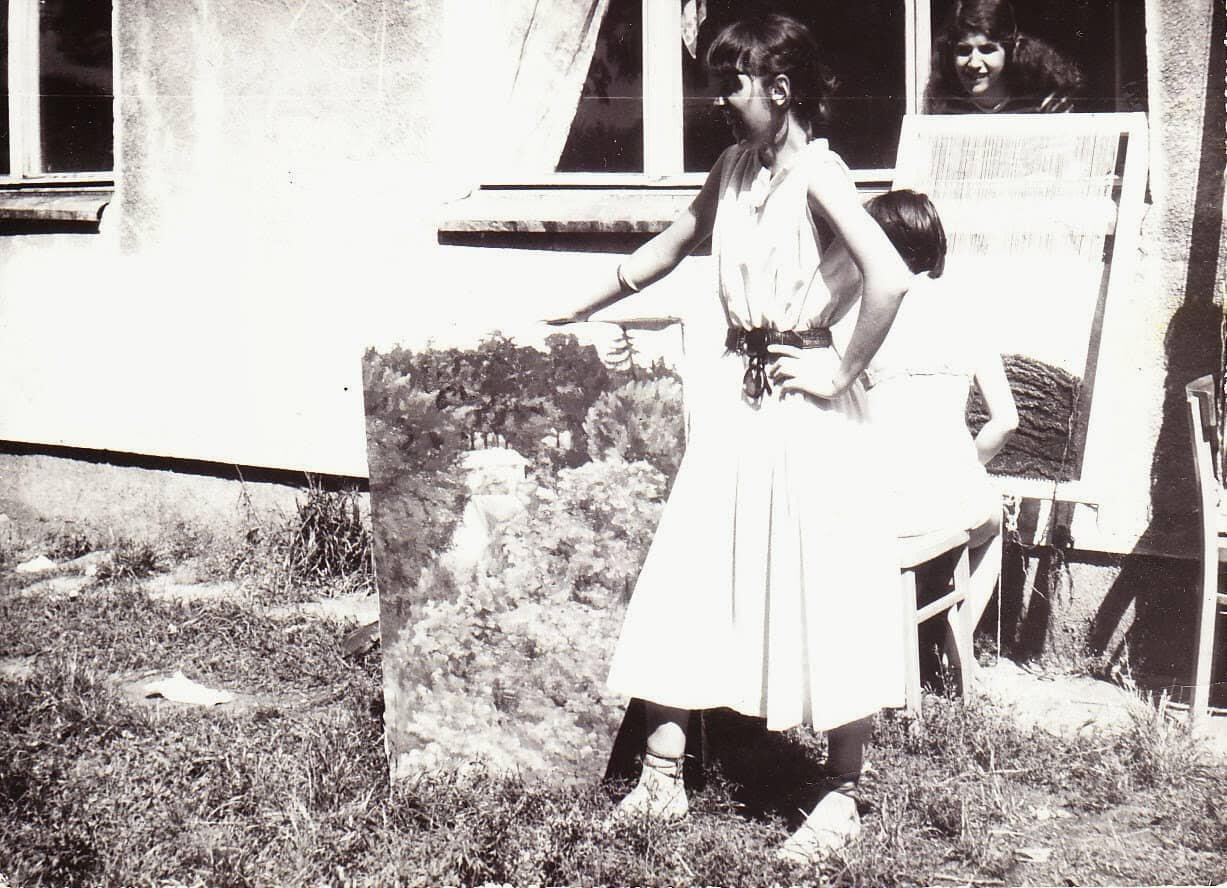 Renata in Art School with one of her finished paintings.